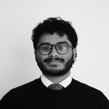 Naman Headshot Close Up BW 2025.jpg